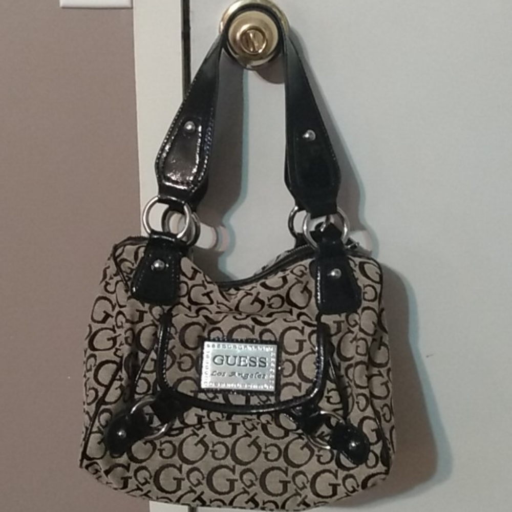 Guess purse with matching check book cover.